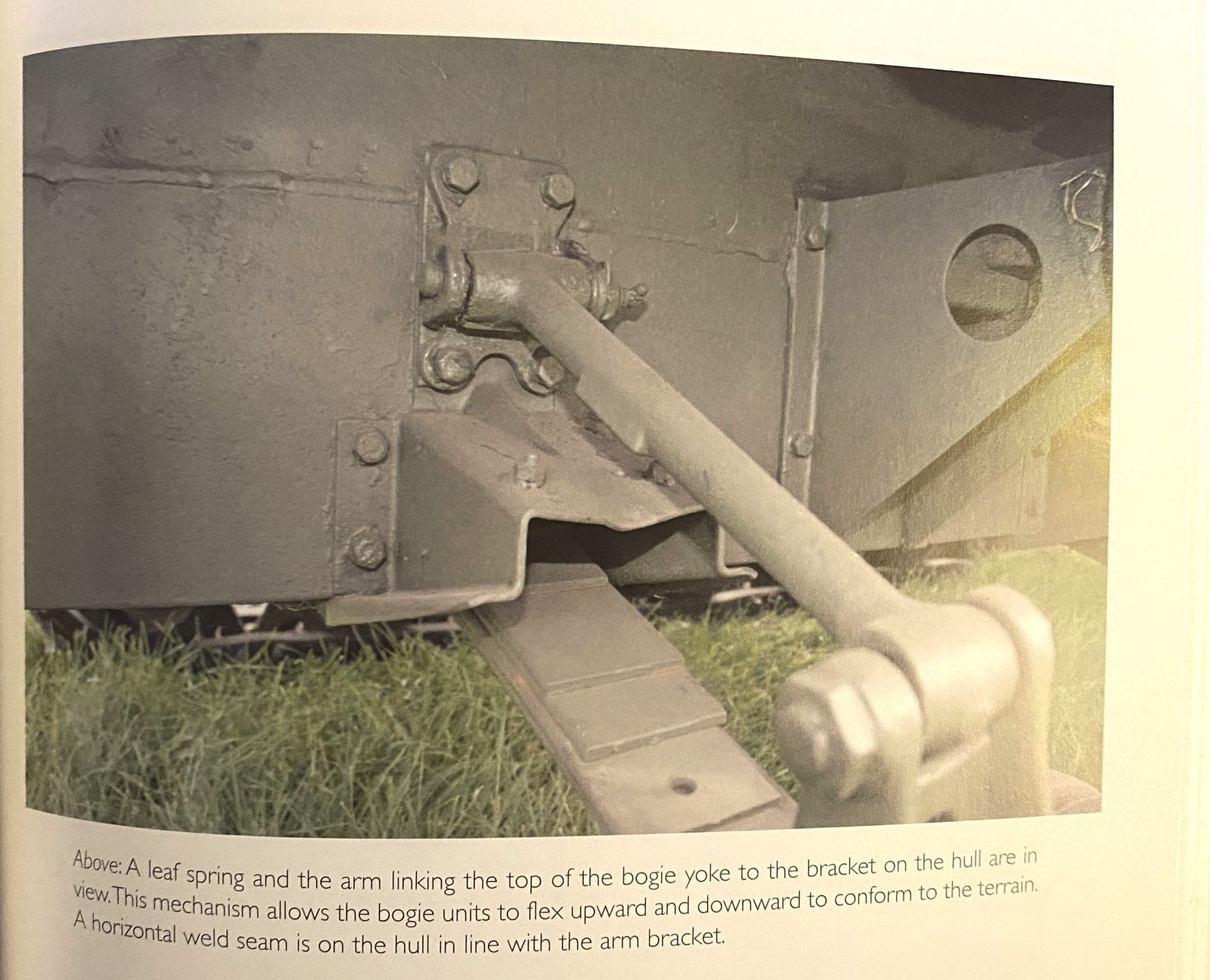 P. 57: leaf spring and the arm linking the top of the bogie yoke to the bracket on the hull.