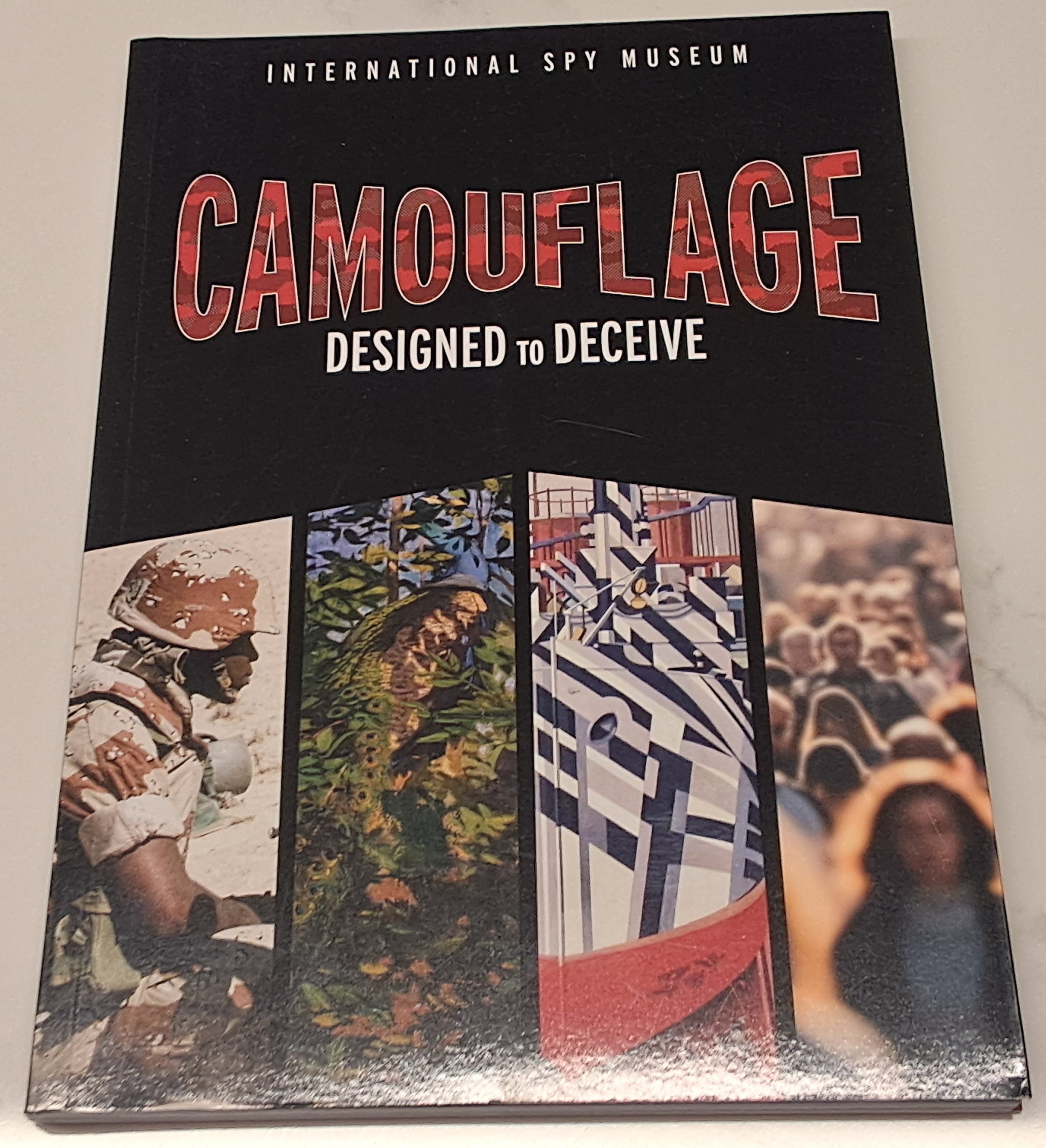 Read review, 'Camouflage, designed to deceive'; from International Spy Museum.